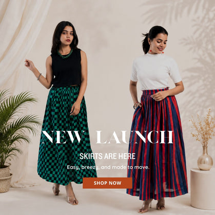 Two women modeling trendy checkered and striped maxi skirts, perfect for easy, breezy everyday wear.