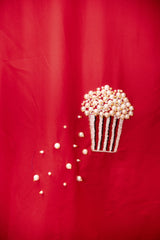 Red fabric with beaded popcorn patch, pearl details, trendy women’s fashion accent