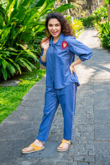 Woman outdoors in blue co-ord set with heart detail, casual everyday style fashion
