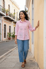 Pink floral embroidered shirt with blue jeans, stylish casual women's outfit