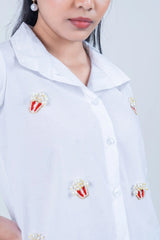 White shirt with pearl and bead popcorn embellishments, stylish women's fashion