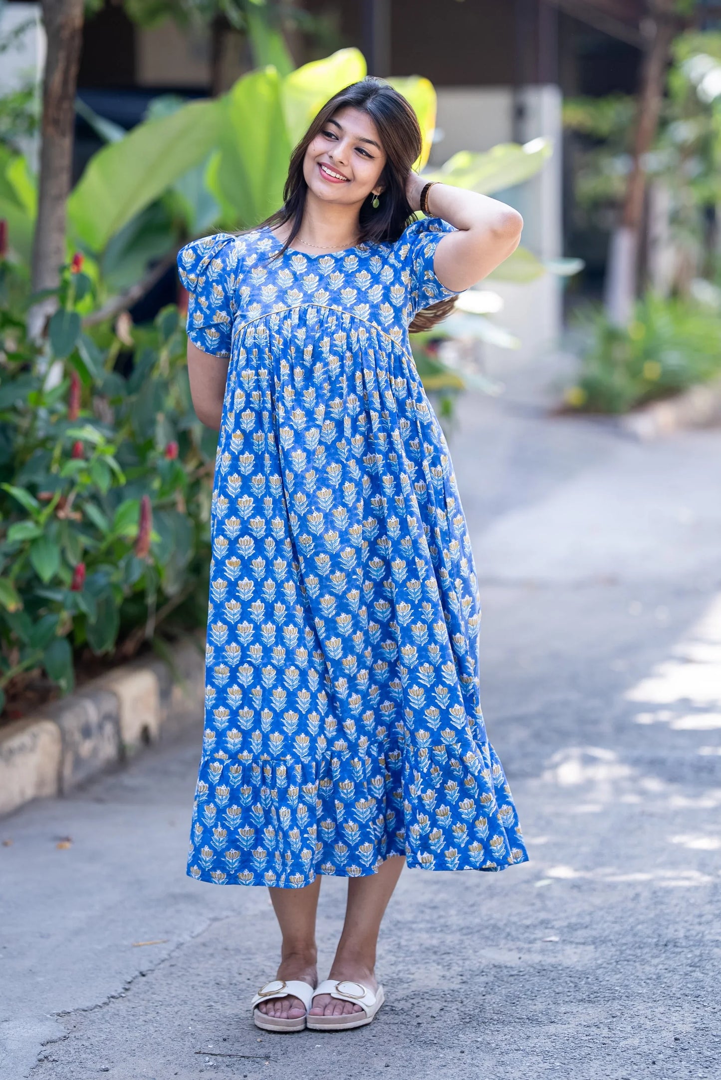 Blue floral print midi dress with puff sleeves, perfect for casual outings