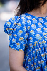Blue floral dress with puff sleeves and yellow accents, stylish women's fashion