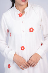 White long-sleeve kurta with red floral prints, button-up front, worn by a woman