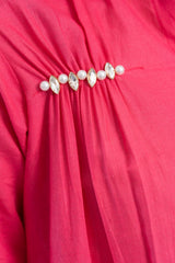 Pink dress with pearl and crystal embellishments, trendy women's fashion detail