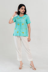 Turquoise lemon-embroidered shirt with white pants, stylish women's co-ord set