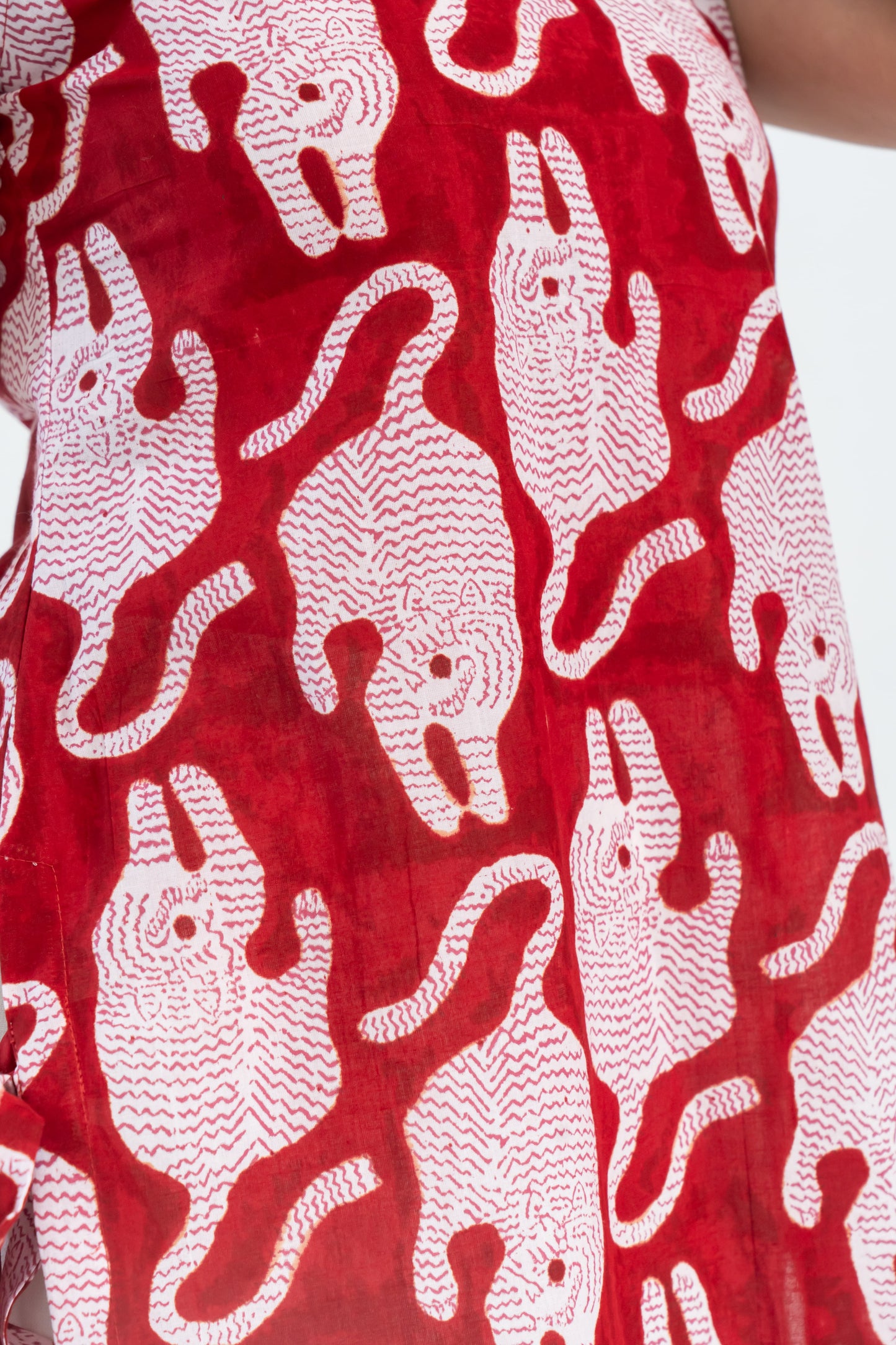 Red and white patterned women's dress with playful animal print design