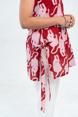 Red and white bunny print tie-front top with white pants