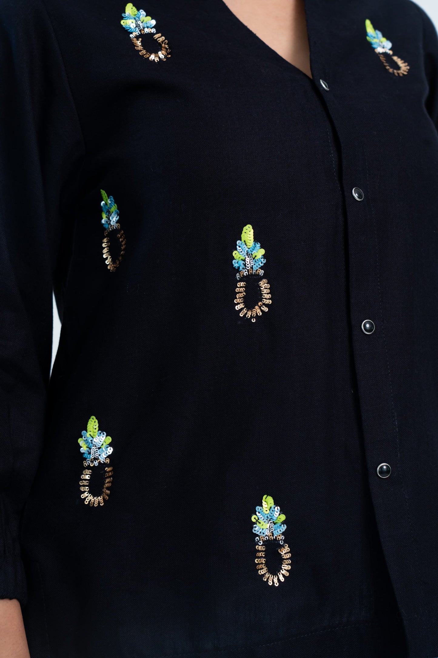 Black embroidered blouse with colorful sequin patterns, stylish women's fashion