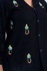 Black embroidered blouse with colorful sequin patterns, stylish women's fashion