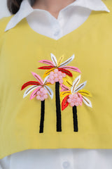Yellow top with colorful palm tree embroidery and pink bead details