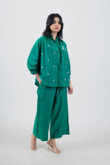 Emerald green embroidered co-ord set with daisy details, wide-leg pants, and puff sleeves for women