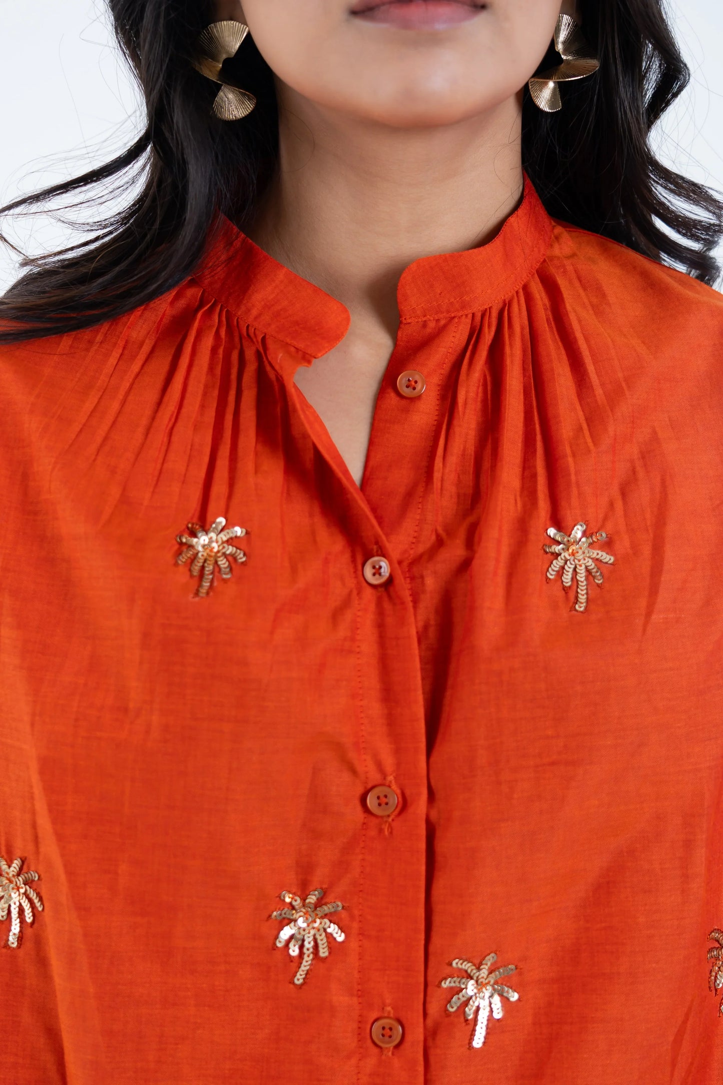 Orange shirt with palm tree sequin embroidery and button front