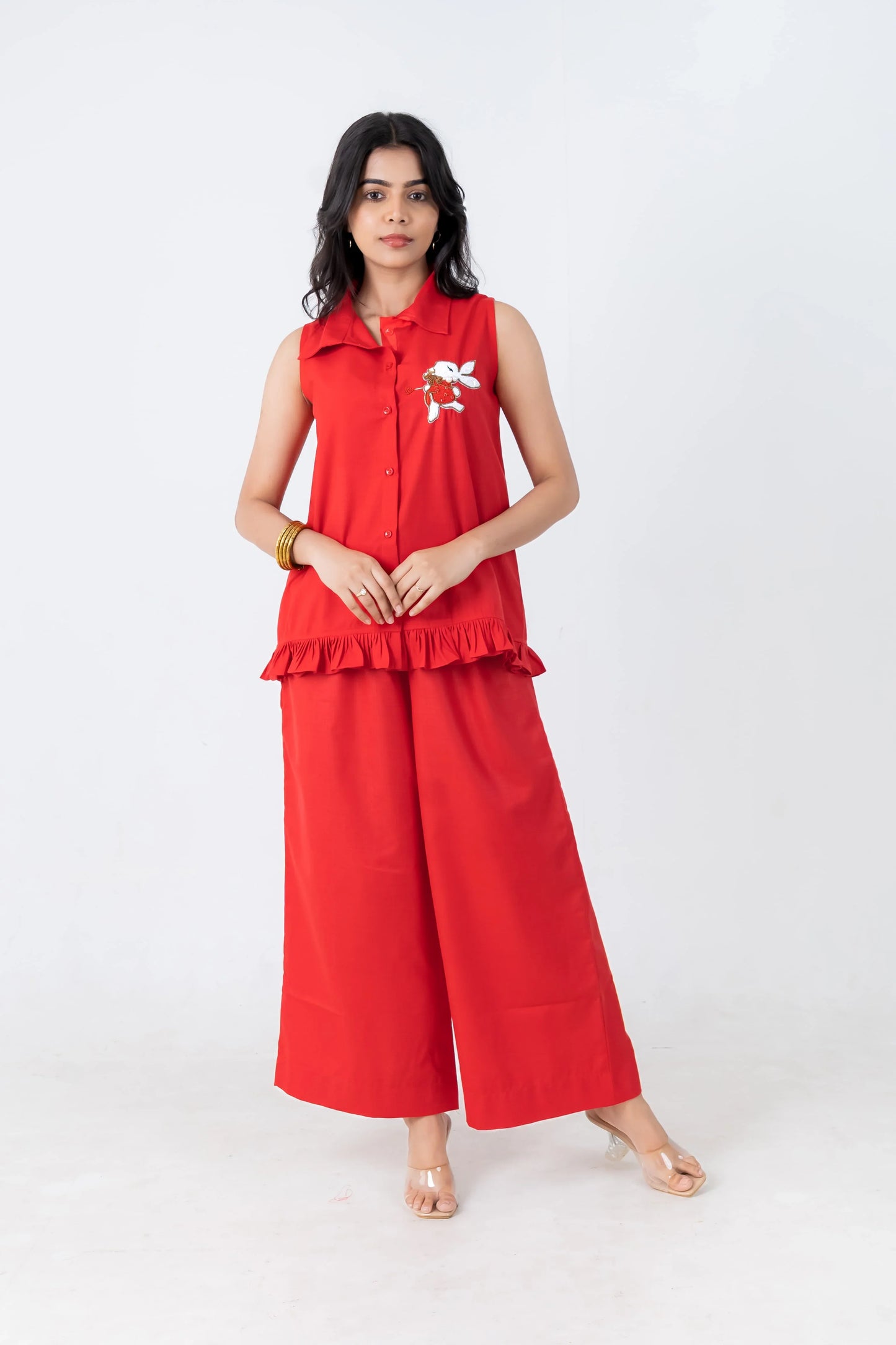 Red sleeveless collared top with bunny embroidery and ruffle hem paired with wide-leg pants, women's co-ord set