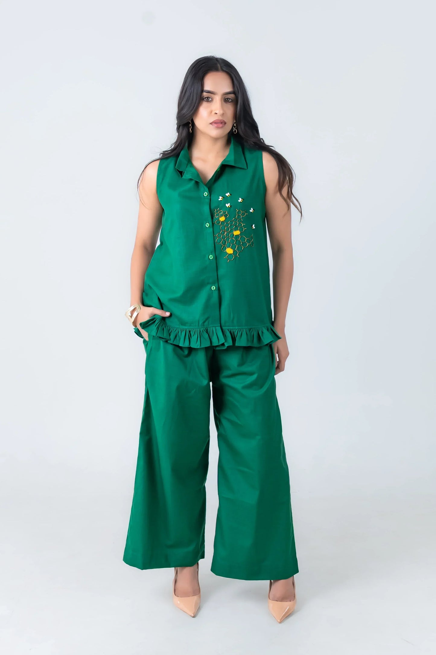 Emerald green sleeveless co-ord set with bee embroidery, ruffle hem, and wide-leg pants for women