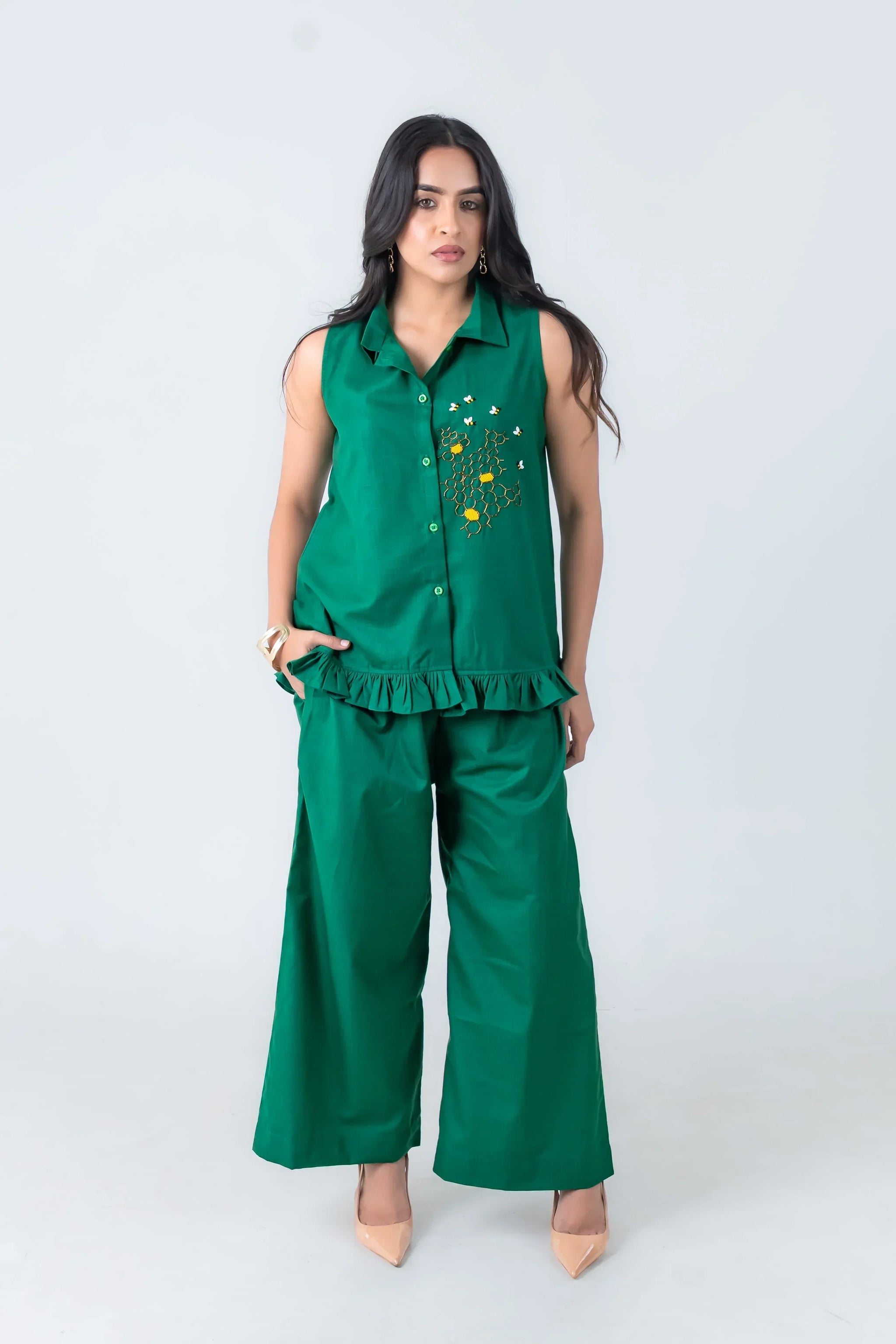 Emerald green sleeveless co-ord set with bee embroidery, ruffle hem, and wide-leg pants for women