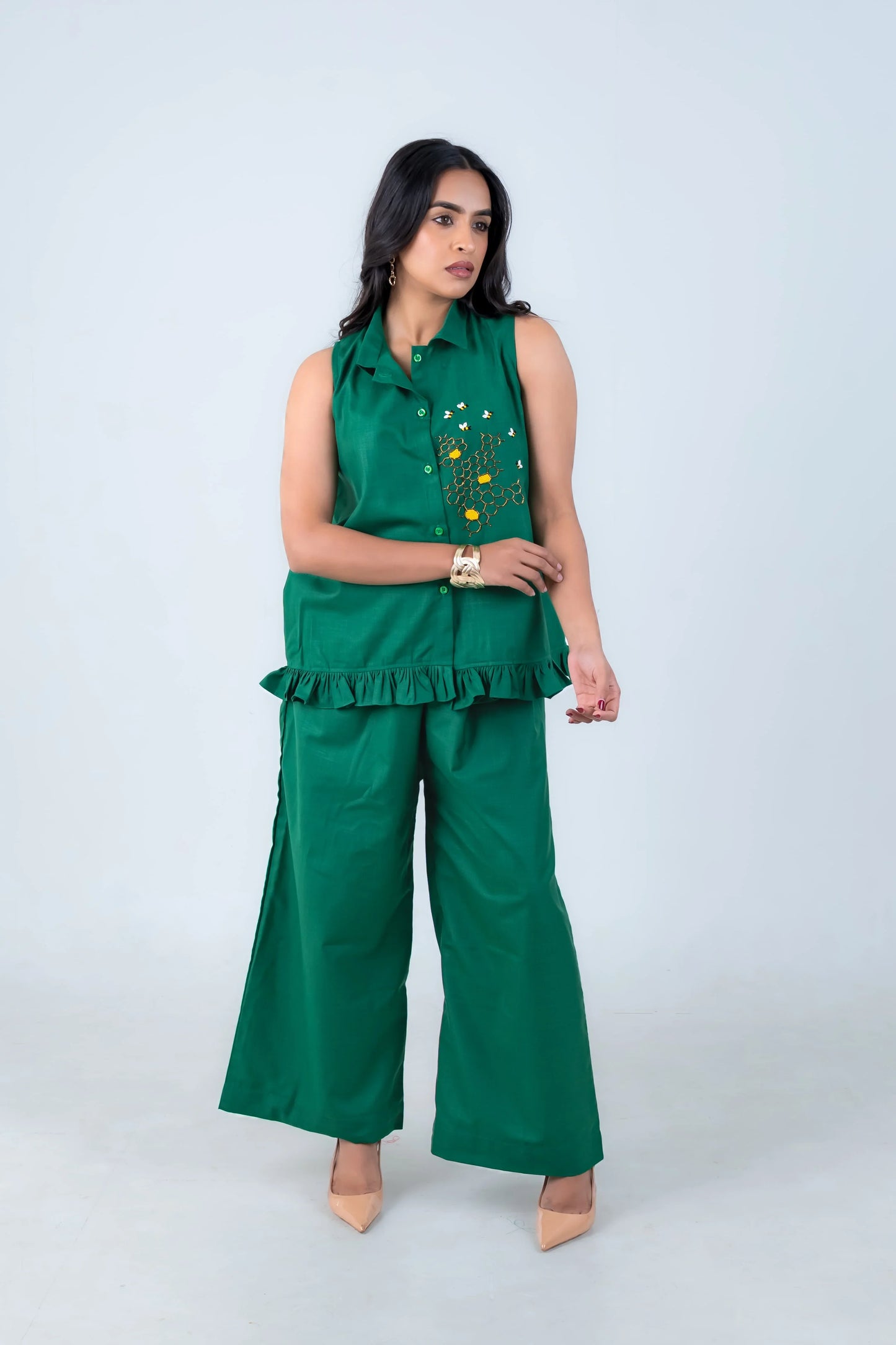 Emerald green sleeveless co-ord set with floral embroidery and wide-leg pants