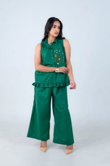 Emerald green sleeveless co-ord set with floral embroidery and wide-leg pants