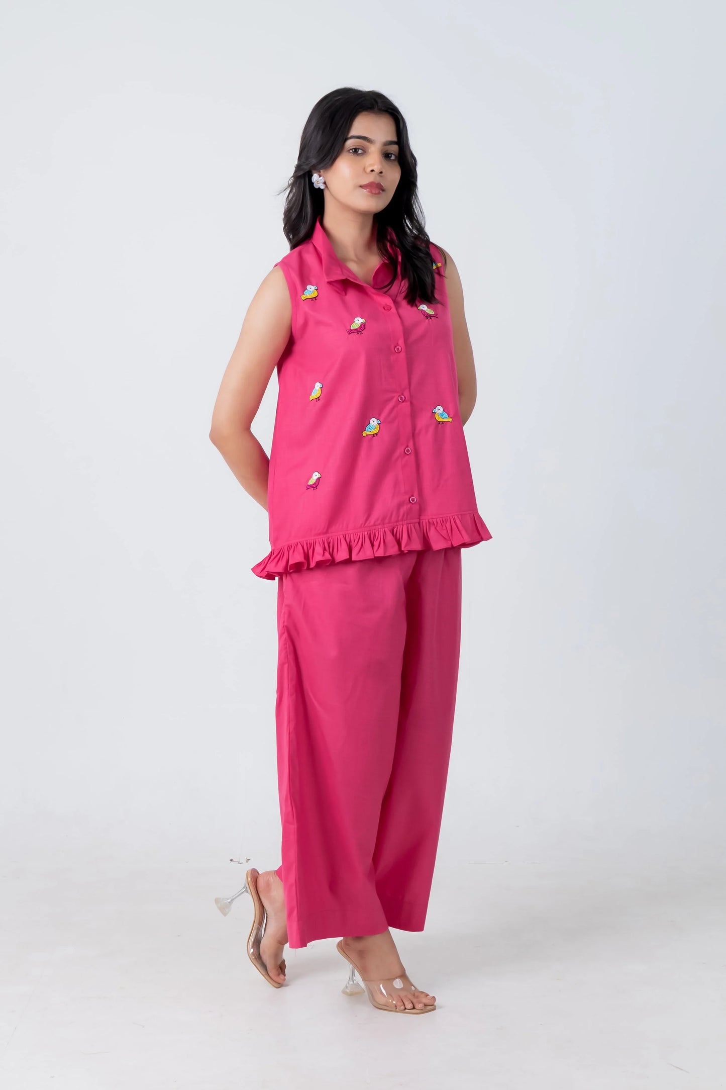 Pink sleeveless bird-embroidered co-ord set with ruffle hem and wide-leg pants
