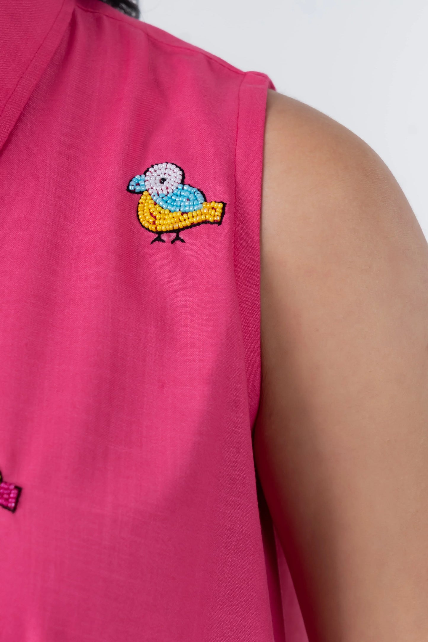 Pink sleeveless dress with colorful beaded bird embroidery, trendy women's fashion