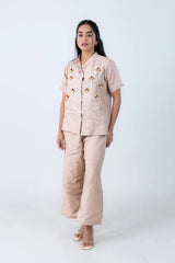 Beige linen co-ord set with floral embroidery, button-front top and wide-leg pants for women