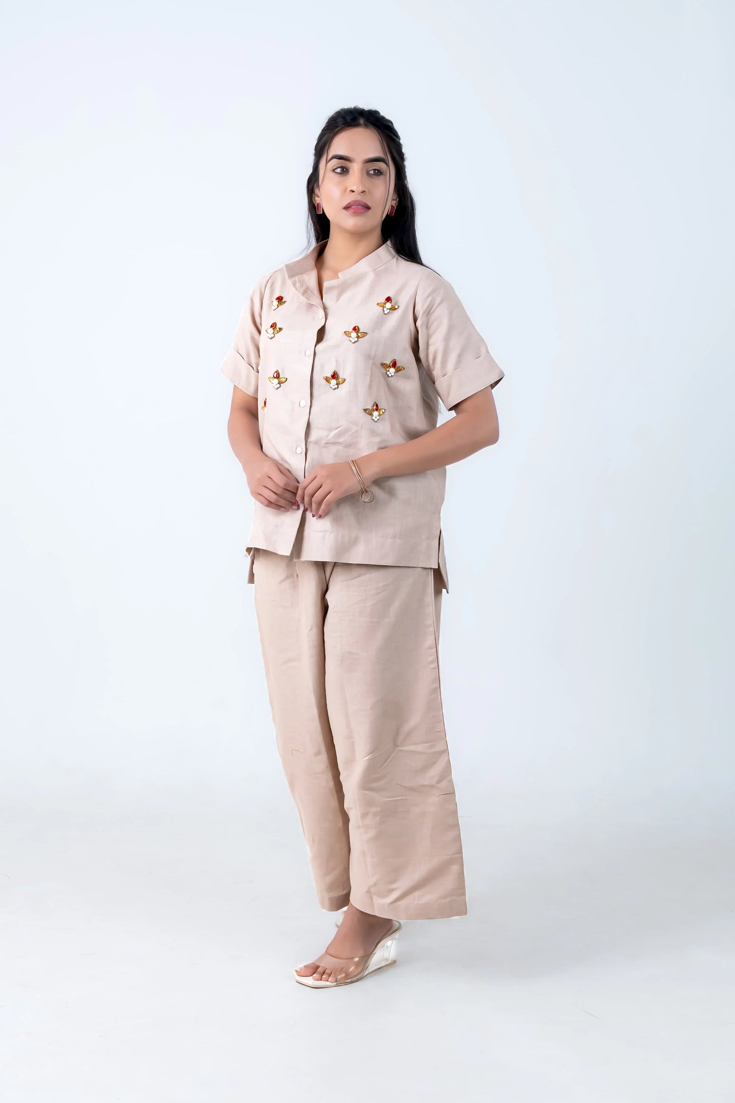 Beige women's co-ord set with floral embellishments, button-front top and wide-leg pants, stylish everyday wear