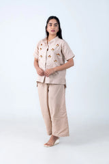 Beige women's co-ord set with floral embellishments, button-front top and wide-leg pants, stylish everyday wear