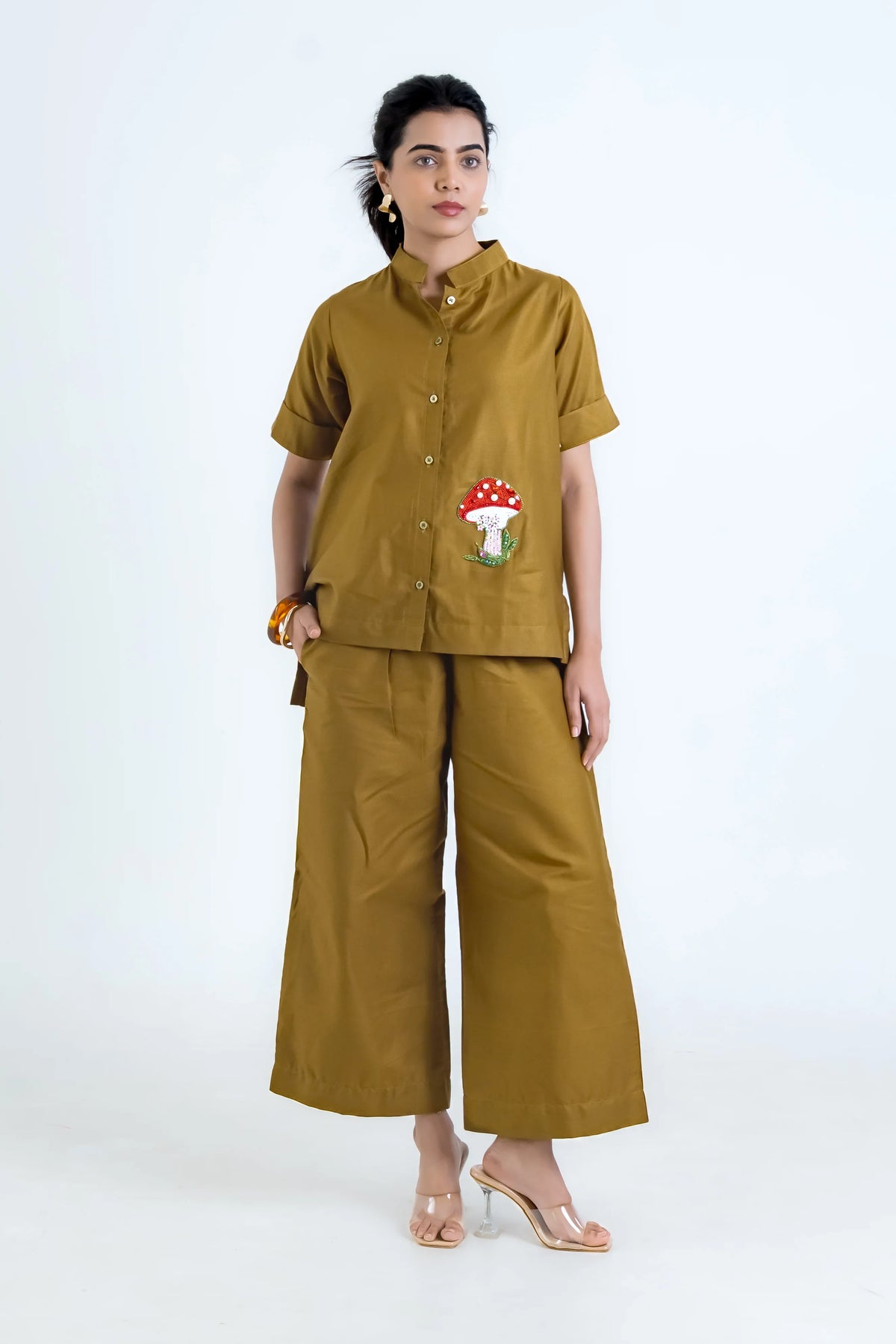 Mustard women's co-ord set with mushroom embroidery, wide-leg pants, and button-up top for everyday style