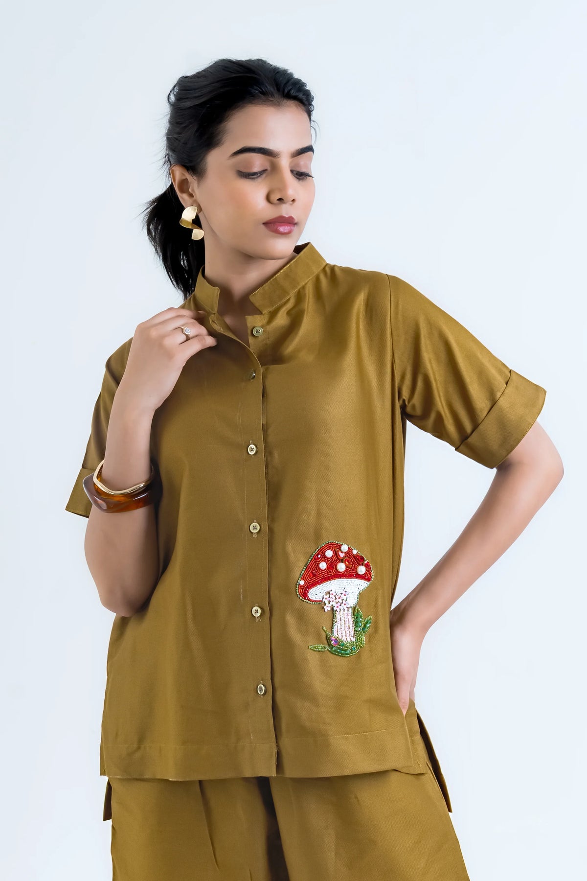 Mustard women's shirt with beaded mushroom embroidery, short sleeves, button front, paired with matching pants