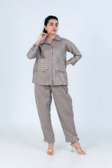Beige linen co-ord set with sequin pocket details, button-up shirt and wide-leg pants for women