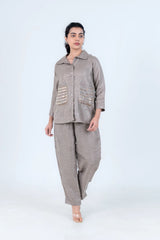 Grey linen co-ord set with embellished pockets, button-front shirt and wide-leg pants for women