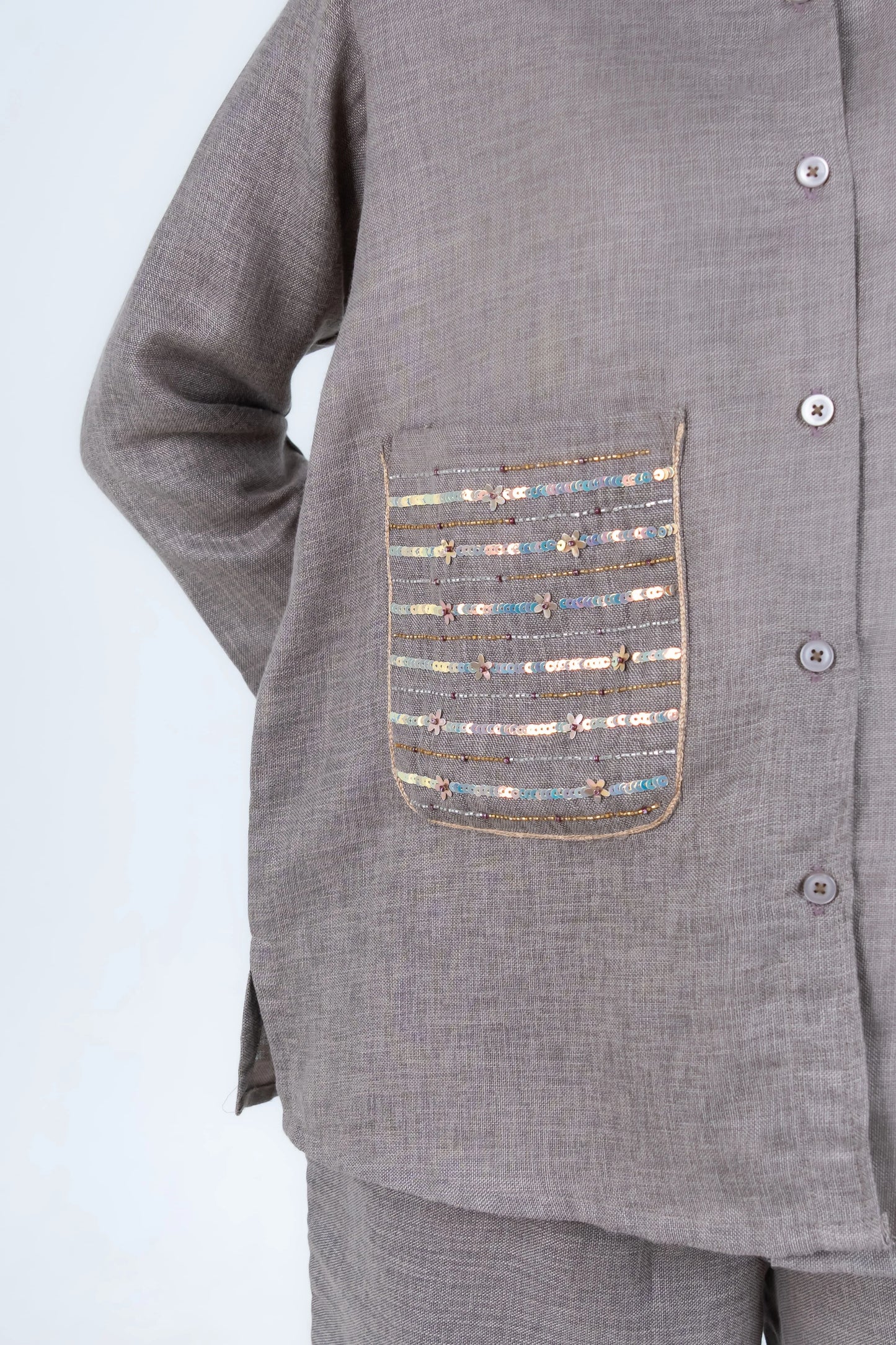 Grey button-up shirt with sequin and bead embellished pocket detail