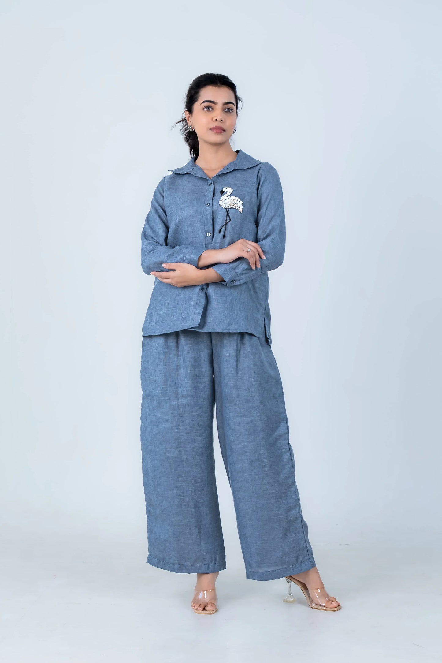 Blue linen co-ord set with flamingo embroidery, wide-leg pants, and button-up top for women