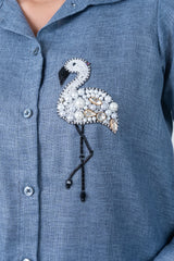 Blue shirt with beaded flamingo embellishment featuring pearls and rhinestones