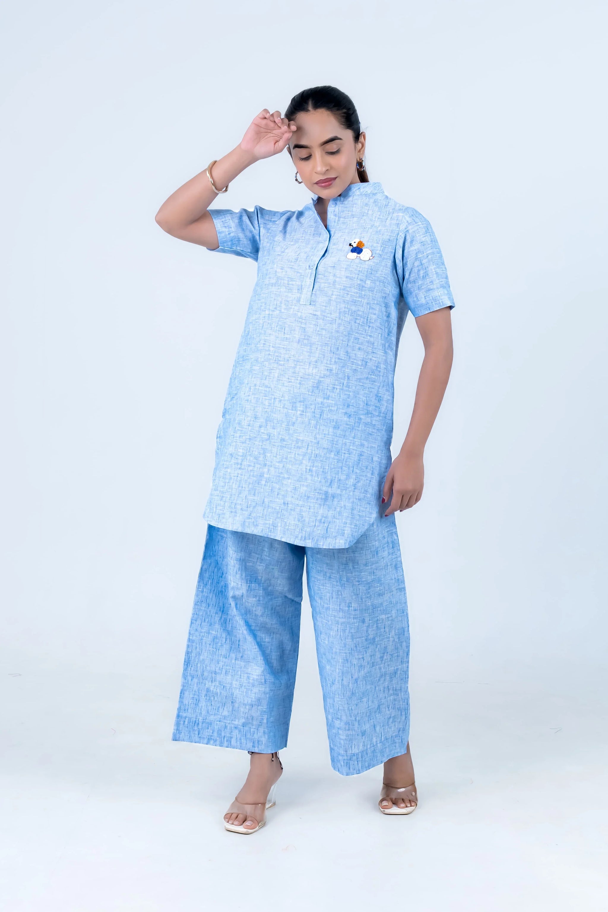 Light blue linen kurta with dog embroidery paired with wide-leg pants, stylish women's co-ord set