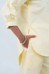 Pale yellow puff sleeve shirt with gold bangle, stylish women's fashion