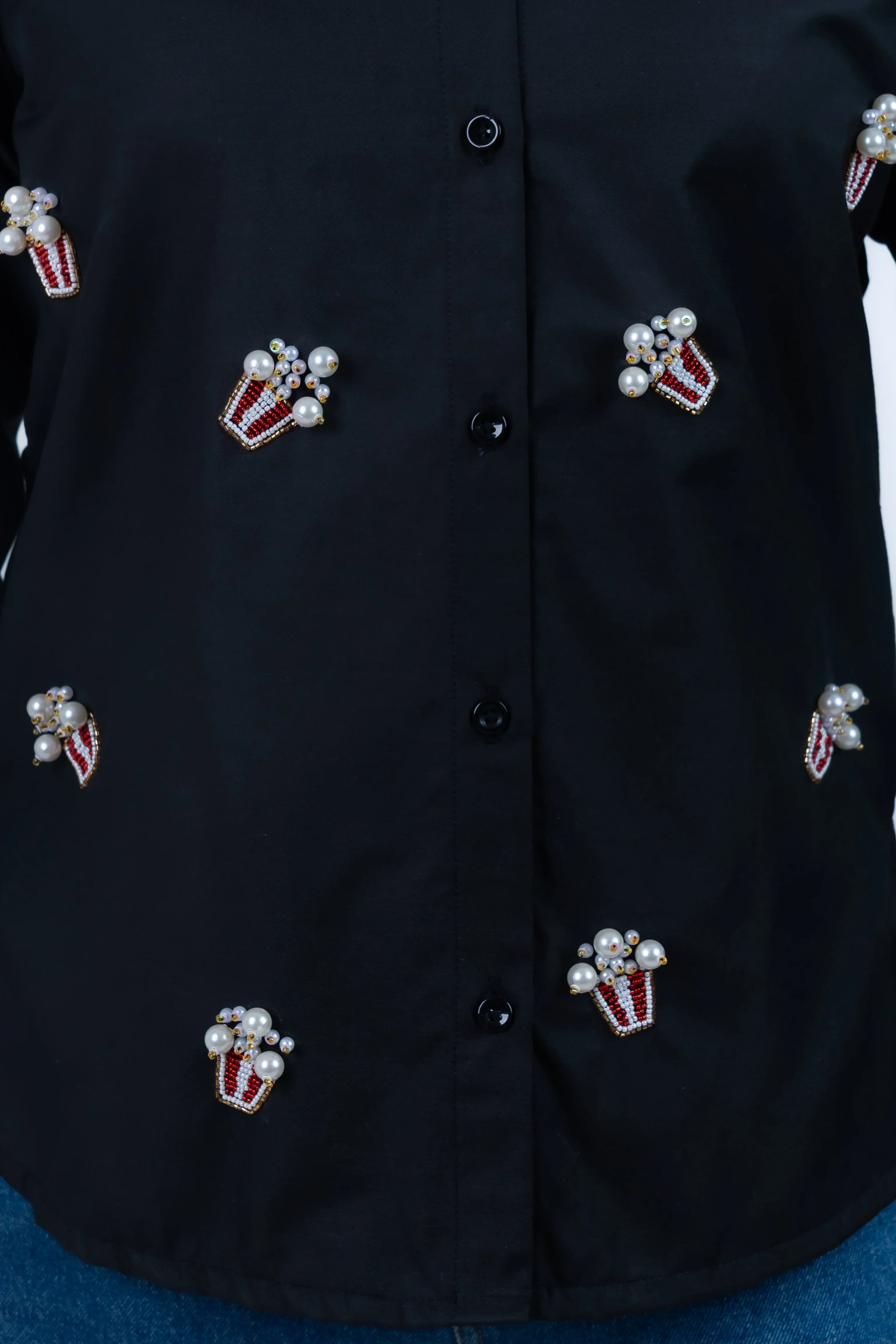 Black shirt with pearl and bead popcorn embellishments, stylish women's fashion