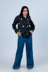 Black popcorn-embellished shirt with wide-leg jeans, trendy women's fashion outfit