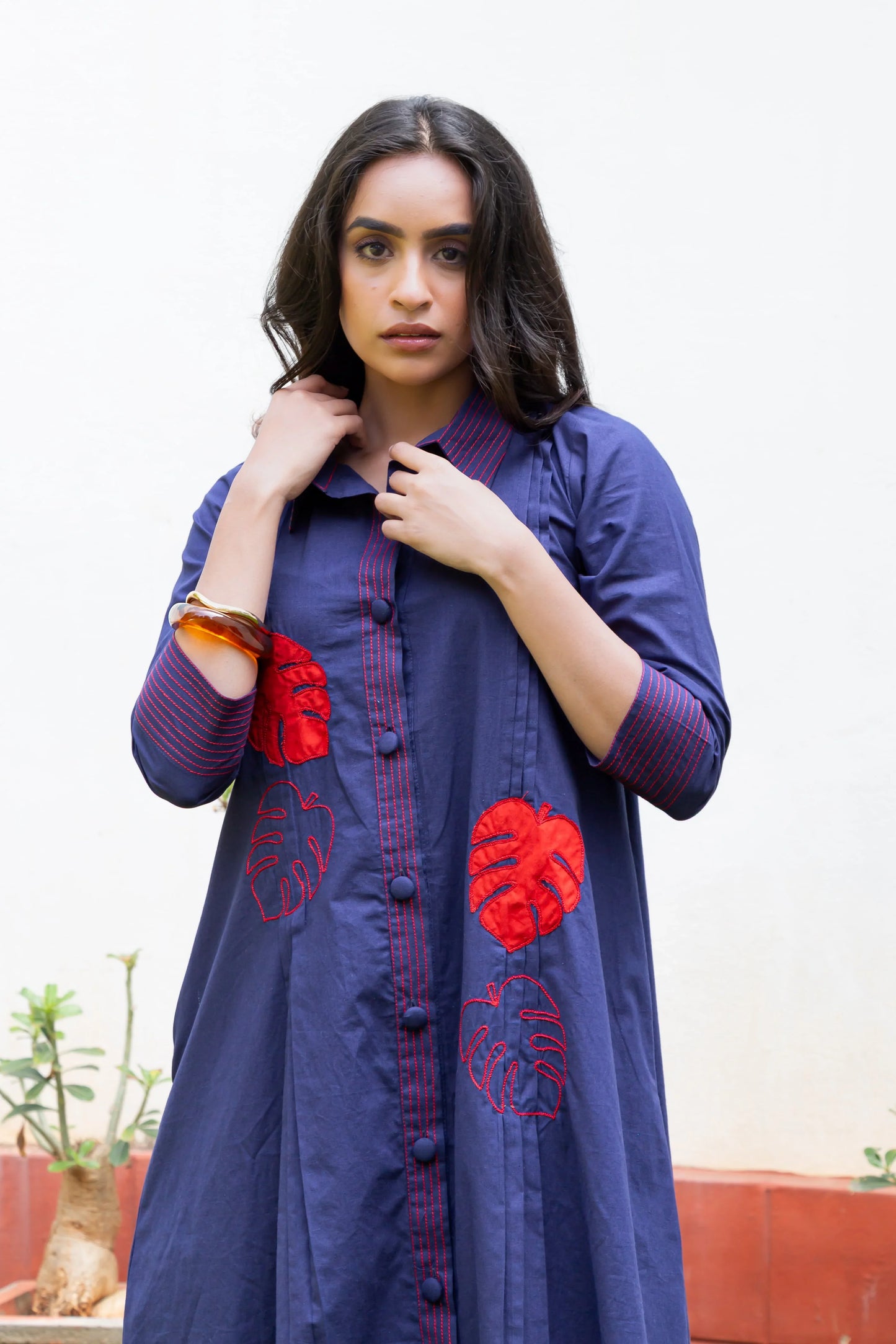 Navy blue dress with red leaf embroidery, button front, and striped cuffs for women's fashion