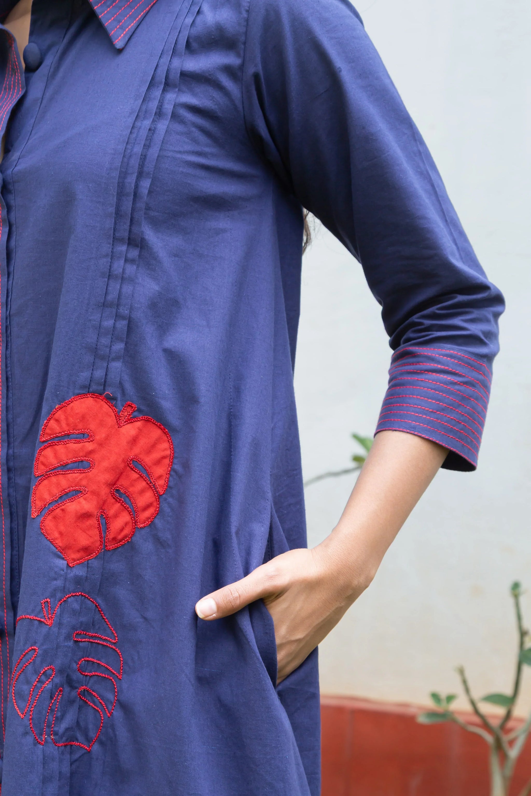Navy blue dress with red monstera leaf embroidery and contrast stitching, stylish everyday wear