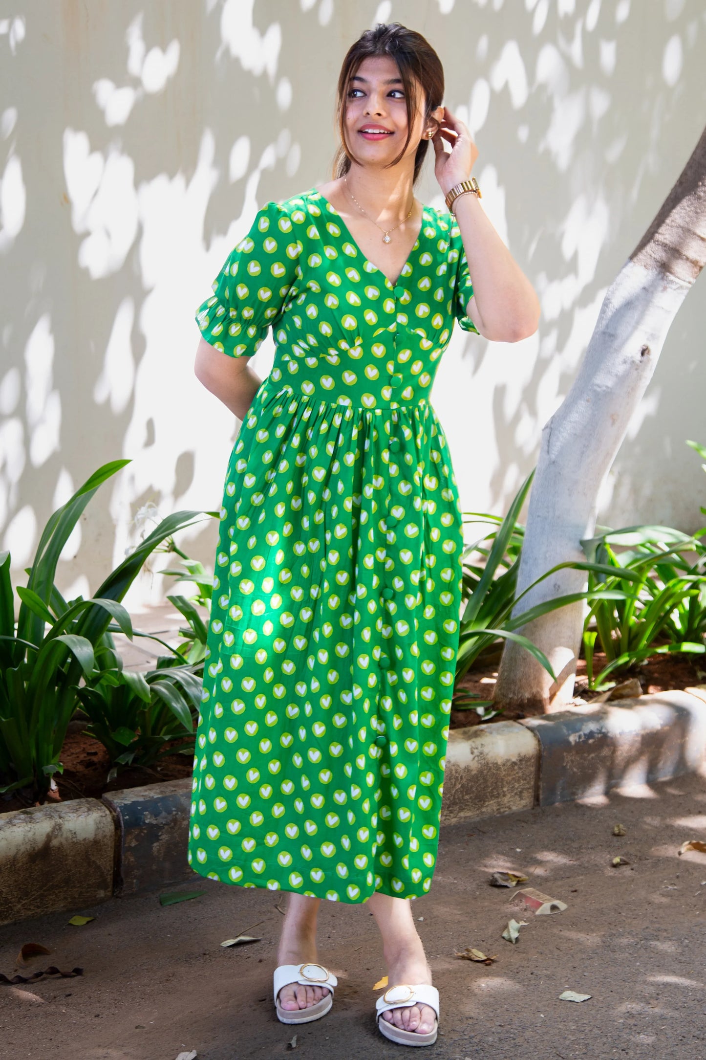 Green heart print midi dress with puff sleeves, perfect for everyday wear and casual outings.