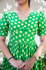 Green heart print dress with puff sleeves and button front, perfect for everyday wear