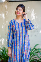 Woman in blue floral print dress with puff sleeves, stylish everyday wear for women
