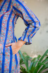 Blue floral printed dress with ruffled sleeves and side pocket