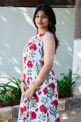 White dress with red floral print, sleeveless design, perfect for casual summer wear