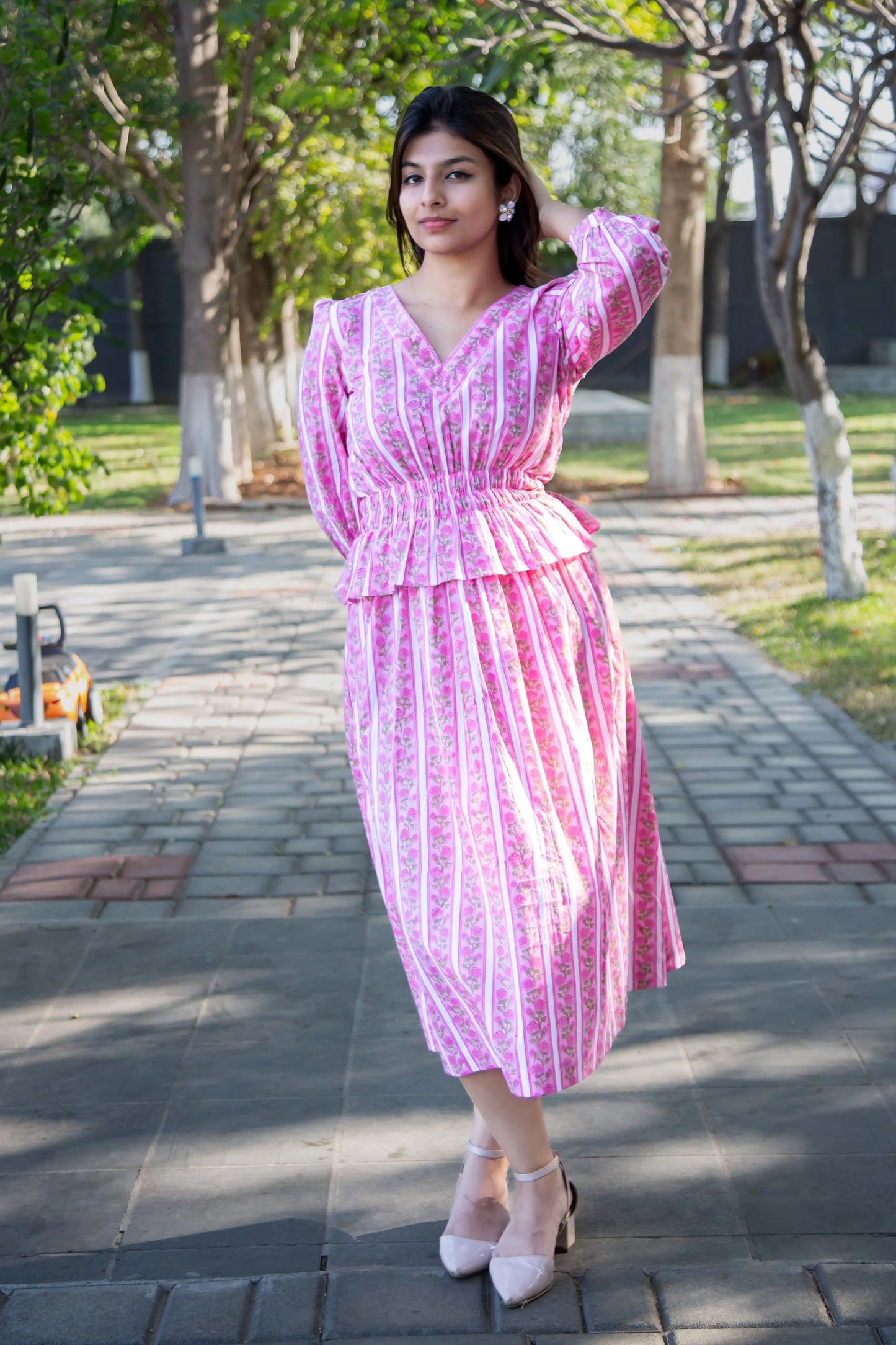 Pink striped floral dress with peplum waist, perfect for everyday wear and comfort