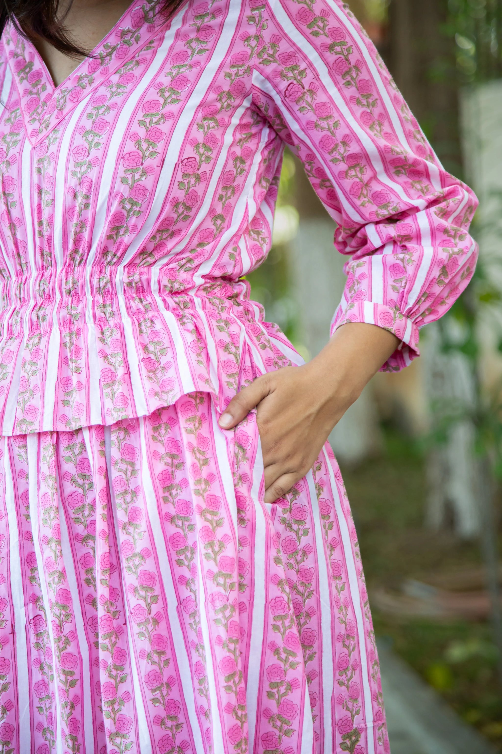 Pink floral striped dress with V-neck and elastic waist, perfect for casual everyday wear