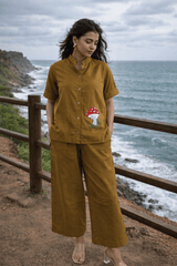 Mustard co-ord set with mushroom embroidery, coastal view, trendy women's fashion