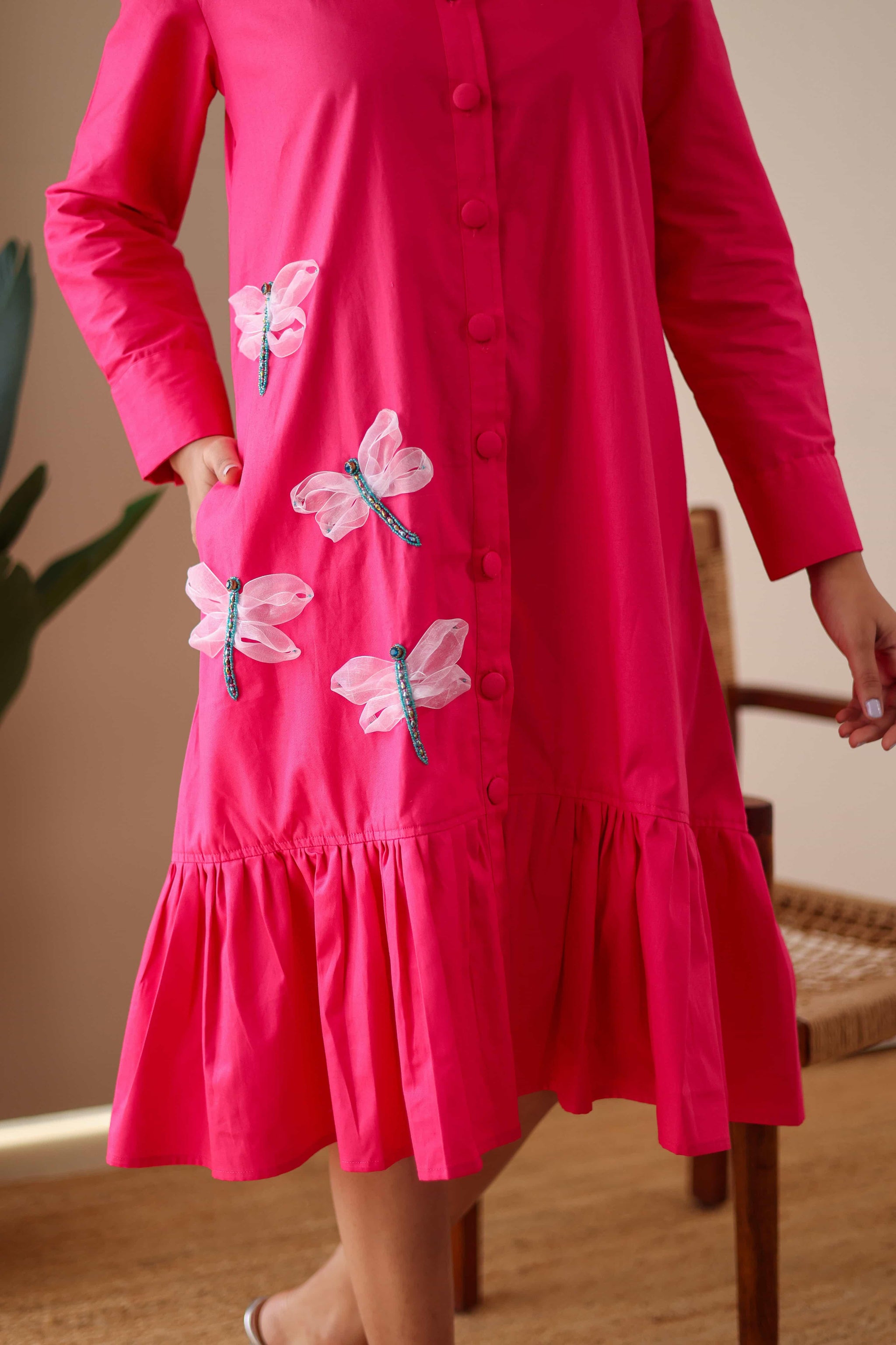 Pink cotton dress with embroidered dragonfly motifs and ruffled hem for women